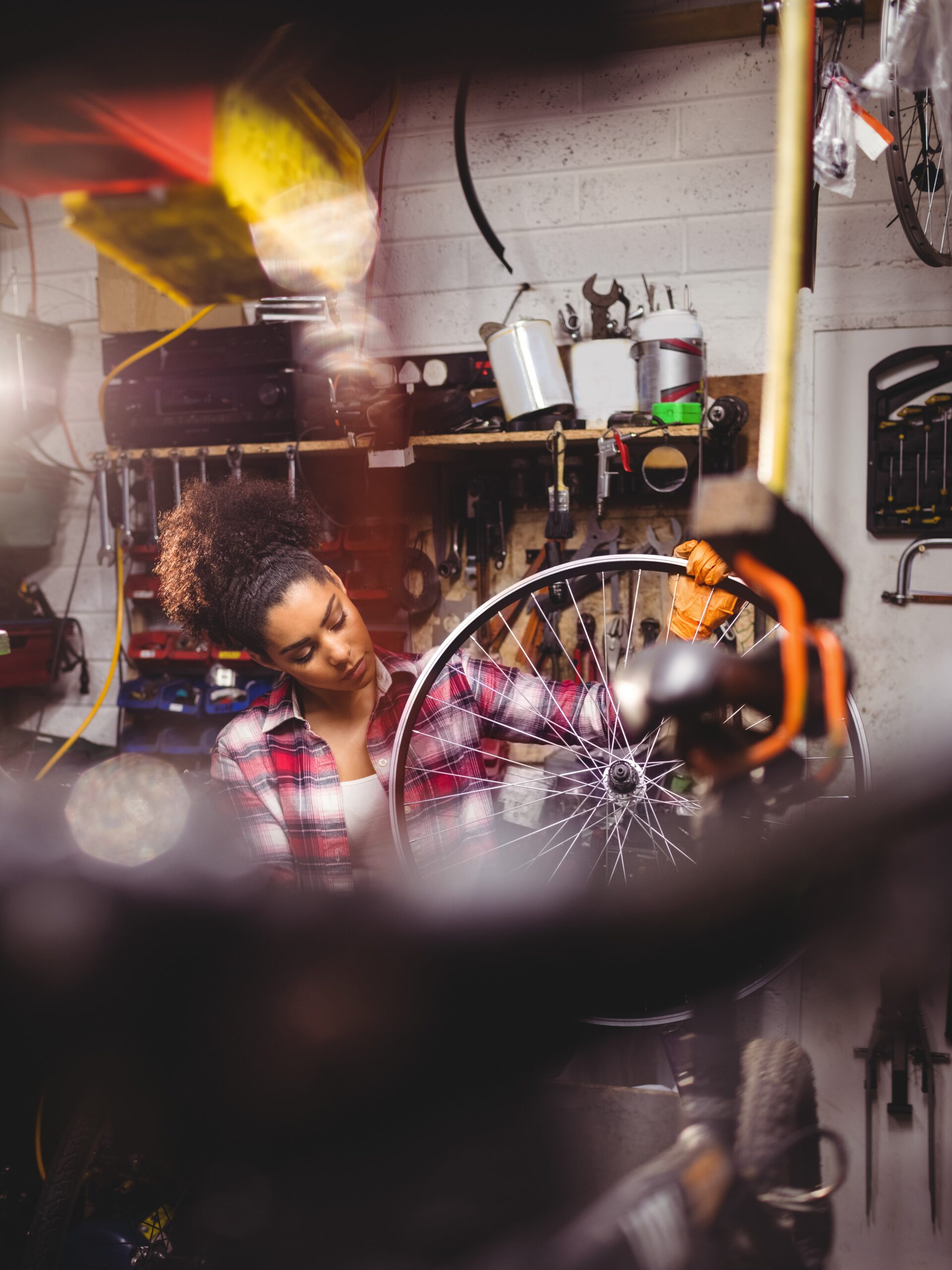 Mechanic examining a bicycle wheel